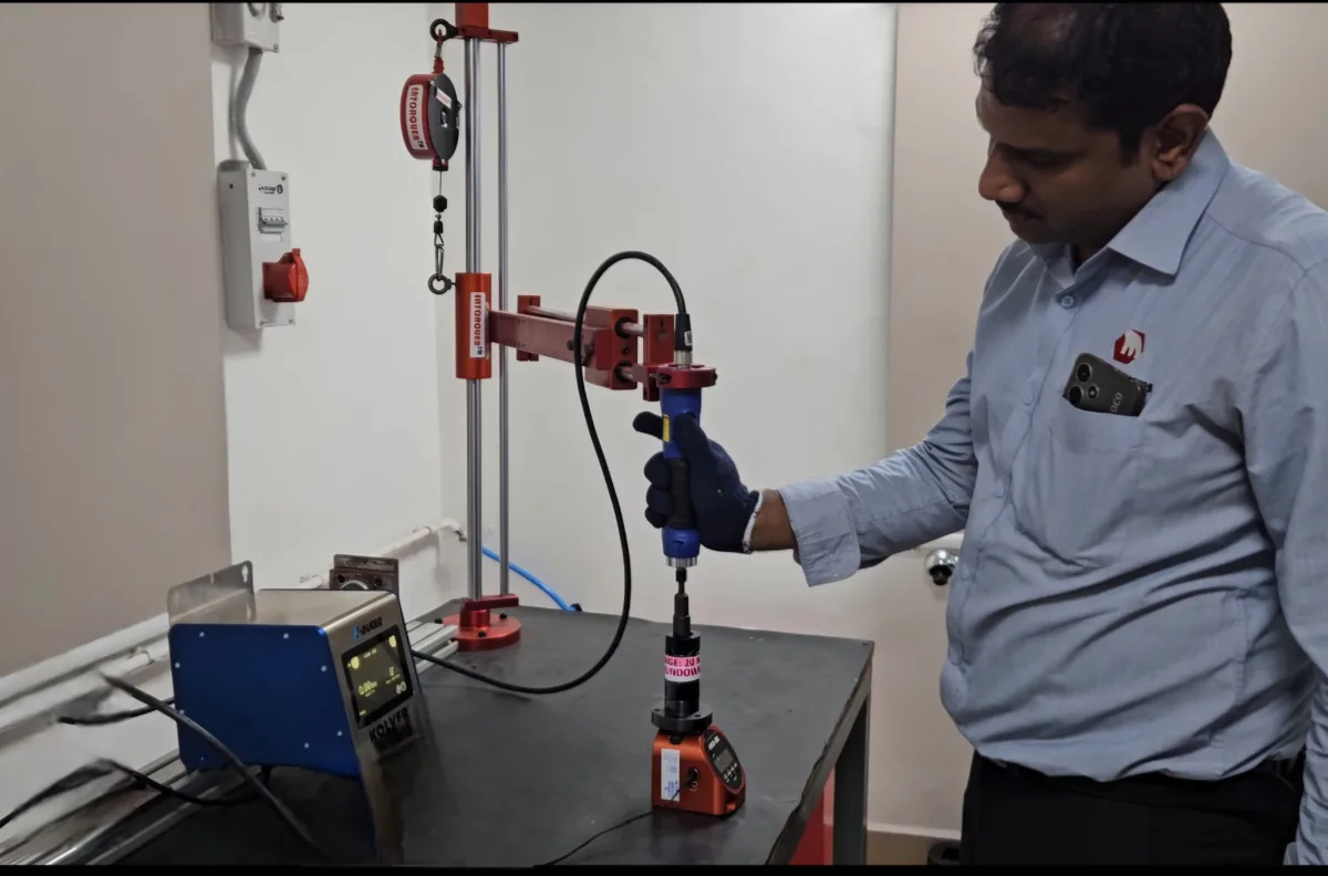 Micromeasures technician using a Kolver electric screwdriver with K-Ducer controller at an assembly bench